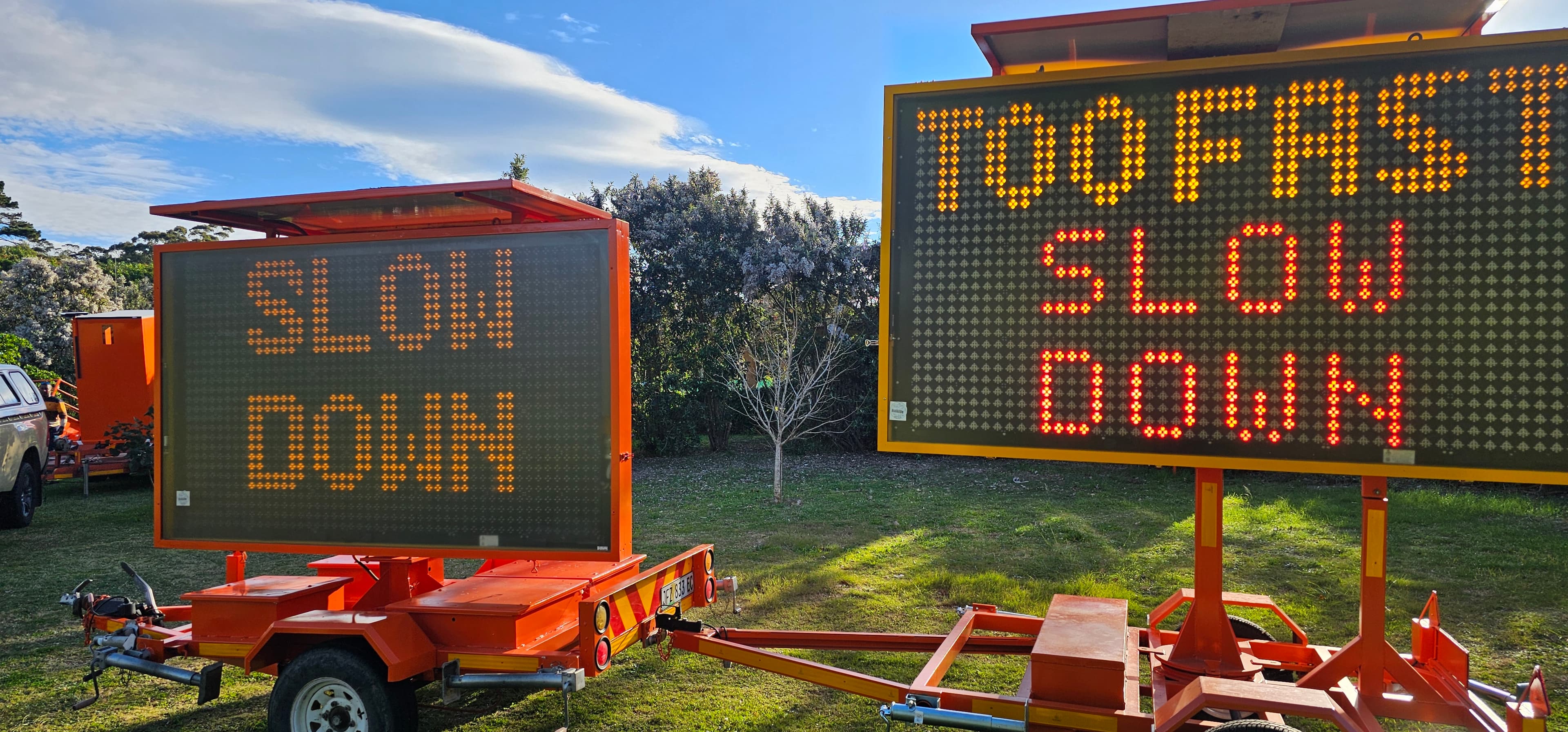 Two Roadsafe variable message signs displaying speed and safety messages