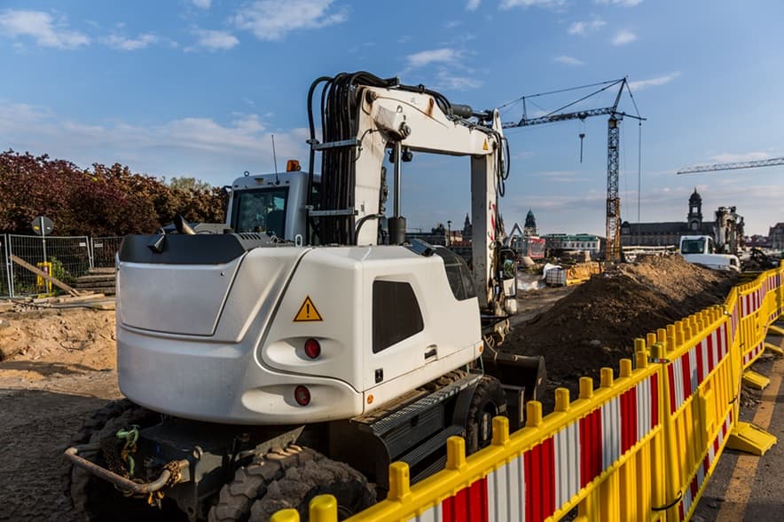 Road construction operation protected by high-visibility barriers